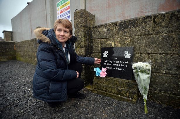Catherine Corless at the boarded up site at Tuam Mothers and Babies home where there is now verified evidence of remains of a significant number of babies and young children being buried. (Photo: Ray Ryan)