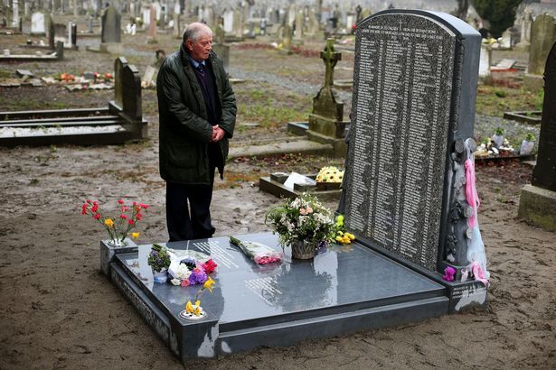 Chairman of the Bethany Survivors group Derek Linster looks at the memorial to 222 children from the Bethany Mother and Child Home, at Mount Jerome Cemetery.