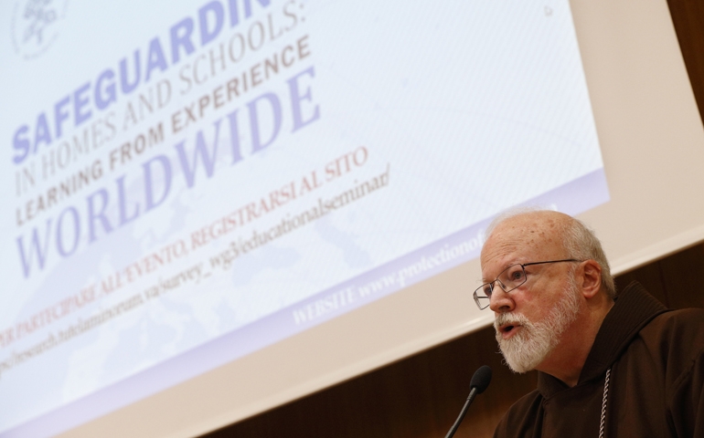 Participants pray at the start of a seminar organized by the Pontifical Commission for the Protection of Minors at the Pontifical Gregorian University in Rome March 23. (CNS /Paul Haring)