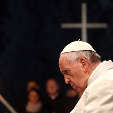 Pope Francis (L) leads the Via Crucis (Way of the Cross) procession during Good Friday celebrations in front of the Colosseum in Rome, Italy, on 14 April 2017