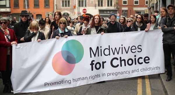 People protest outside the Department of Health in Dublin at plans to grant ownership of the new National Maternity Hospital to the Sisters of Charity religious order.