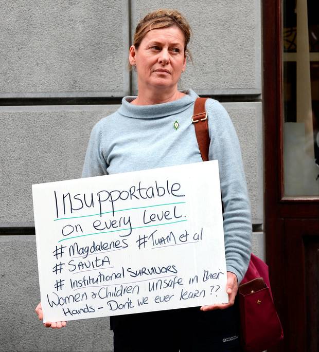 A protester opposed to the Sisters of Charity owning the new national maternity hospital, outside the Department of Health on Poolbeg St, Dublin. Photo: Caroline Quinn