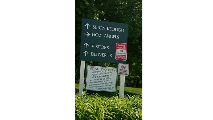 A 'no trespassing' sign has been posted at the entrance of Seton Keough High School. (Amy Kaufman / Los Angeles Times)