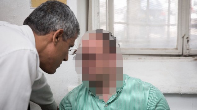 A man is brought to the Jerusalem Magistrate's Court for suspicion of sexually assaulting dozens of women he employed, June 12, 2017. (Hadas Parush/Flash90)