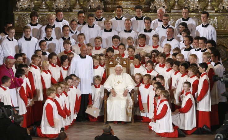 Pope Benedict XVI poses for a group picture with the Regensburg Domspatzen boys' choir on 12 September 2006 REUTERS/Wolfgang Rattay