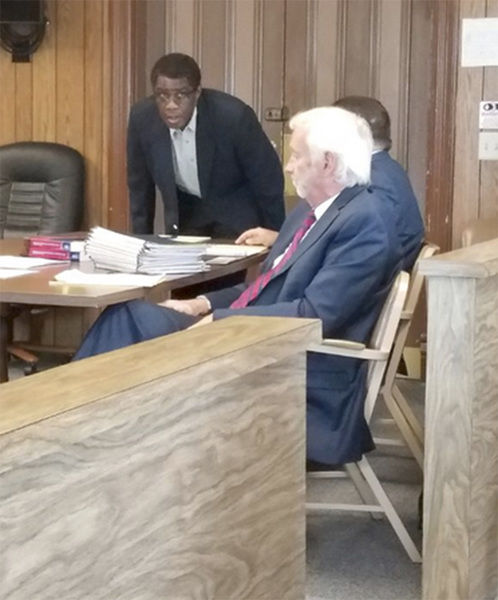 Jordan Spence/The Alpena NewsThe Rev. Sylvestre Obwaka stands during his trial in 53rd Circuit Court in Rogers City.