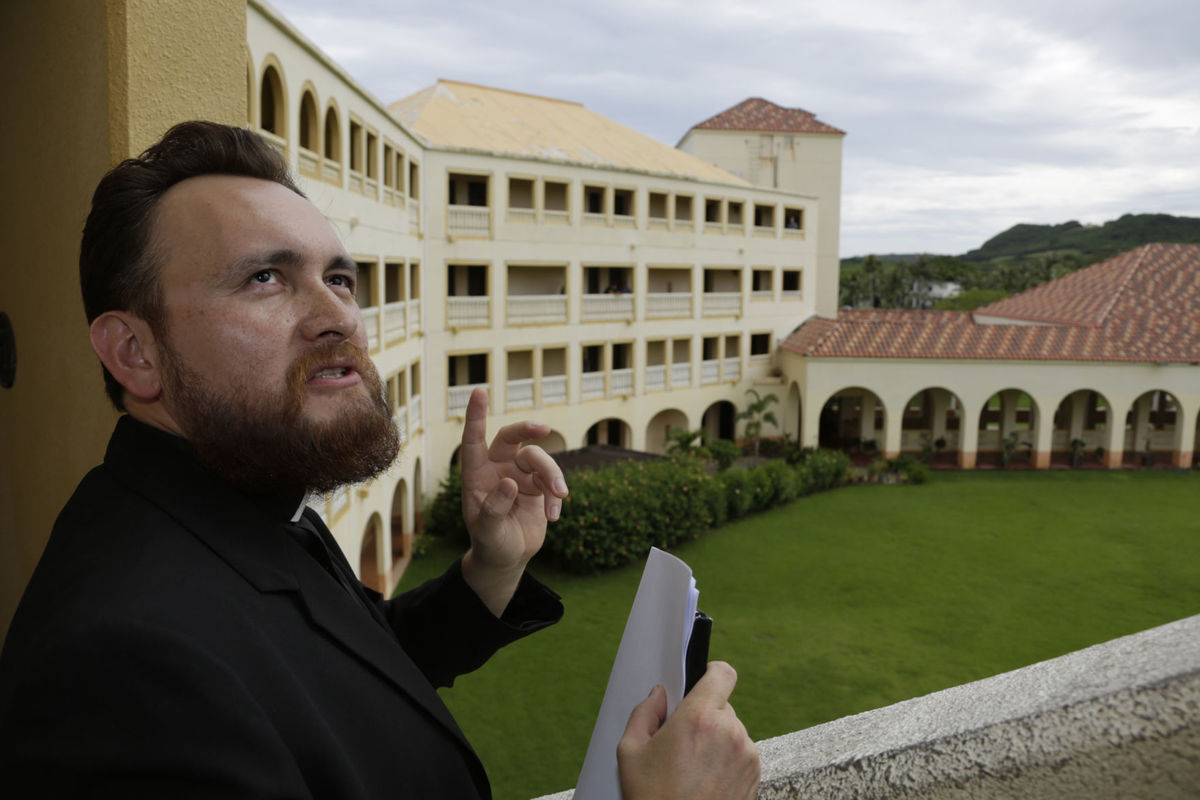 SEMINARY: Rev. Julio Cesar Sanchez Malagon leads a media tour of the Redemptoris Mater Seminary in this file photo. The seminary tops a list of non-essential church properties that could be sold if funds are needed for settlement negotiations in sex abuse cases filed against the church. Post file photo
