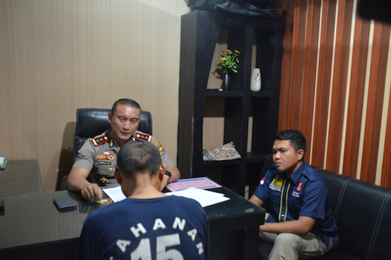 Police question Wawan Sutiono , 49, who is suspected of molesting up to 41 boys at police station in Tangerang, Indonesia. (Photo from TribataNews.com, a local police website)