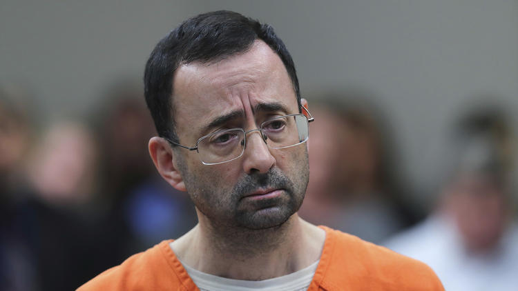 Dr. Larry Nassar appears in court for a plea hearing Nov. 22, 2017, in Lansing, Mich. A Michigan bill inspired by the Nassar scandal that would retroactively extend the amount of time child victims of sexual abuse have to sue their abusers is drawing concerns from the Catholic Church.