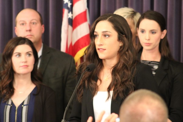 Olympic gold medalist Jordyn Weiber, speaking, joined sexual assault survivors and lawmakers at a press conference announcing legislation to better protect victims of sexual assault on Feb. 26, 2018. (Emily Lawler | MLive.com)