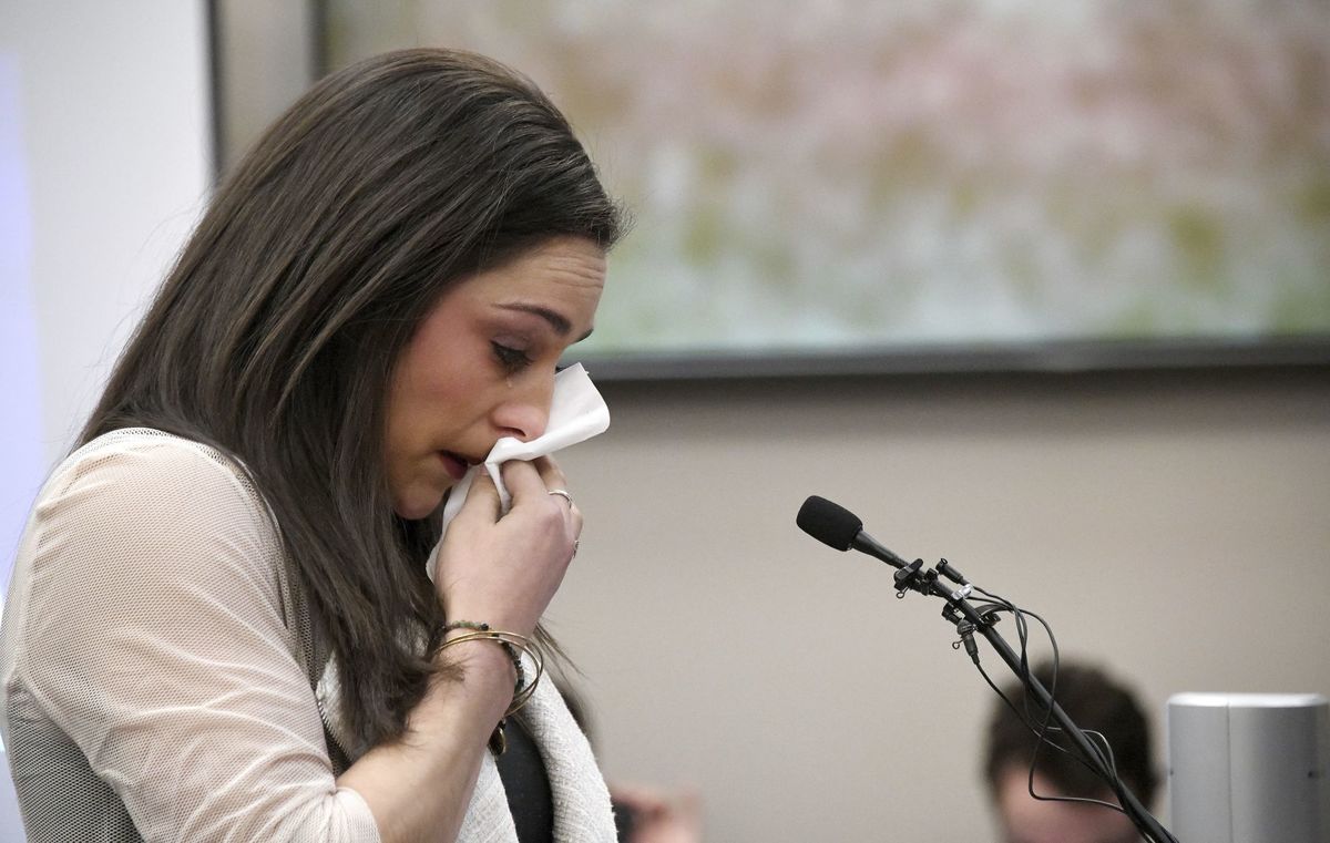FILE - In a Jan. 19, 2018 file photo, Olympic gold medalist Jordyn Wieber cries as she gives her victim impact statement in Lansing, Mich., during the fourth day of sentencing for former sports doctor Larry Nassar, who pled guilty to multiple counts of sexual assault. Bipartisan legislation in Michigan that would help victims of Nassar's sexual abuse move forward with lawsuits was in limbo Wednesday, March 14, amid pushback from universities, the Catholic Church and others. (Dale G. Young/Detroit News via AP)