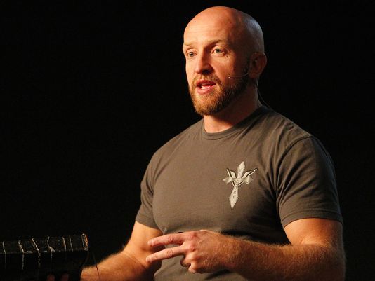 Pastor Paul Burress delivers his message at Victory Church in Henrietta.