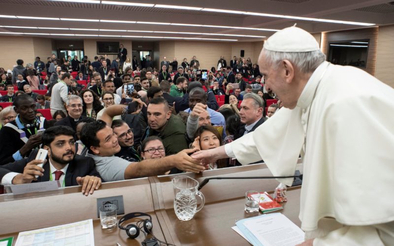 Pope Francis greets a young man during a pre-synod gathering of youth delegates at the Pontifical International Maria Mater Ecclesiae College (CNS)