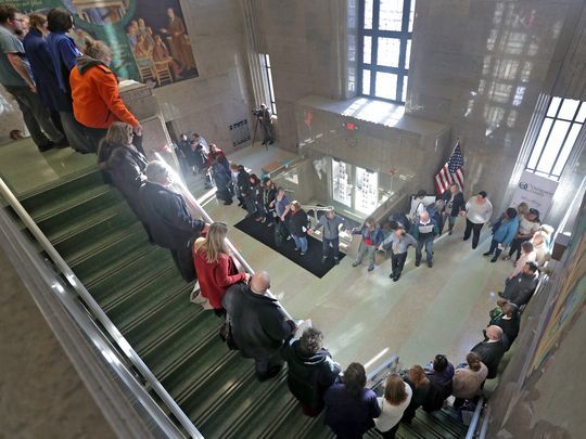 Supporters and advocates hold hands on Wednesday afternoon in the main entrance to the Outagamie County administration building in Appleton during the Hands Around the Courthouse event. (Photo: Wm. Glasheen/USA TODAY NETWORK-Wisconsin)
