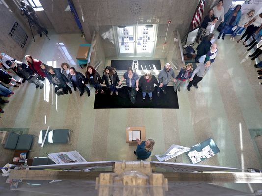 A crowd of supporters and advocates hold hands in the lobby of the Outagamie County administration building during the Hands Around the Courthouse event on Wednesday, April 4 in Appleton. Wm. Glasheen/USA TODAY NETWORK-Wisconsin