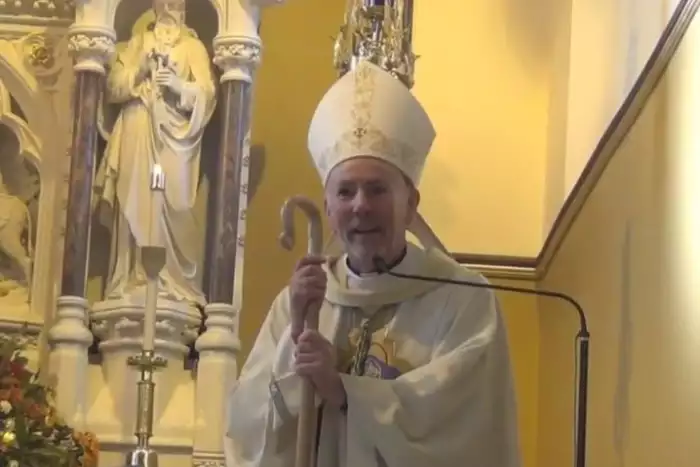 Bishop William Nolan addresses the congregation of Holy Family Church