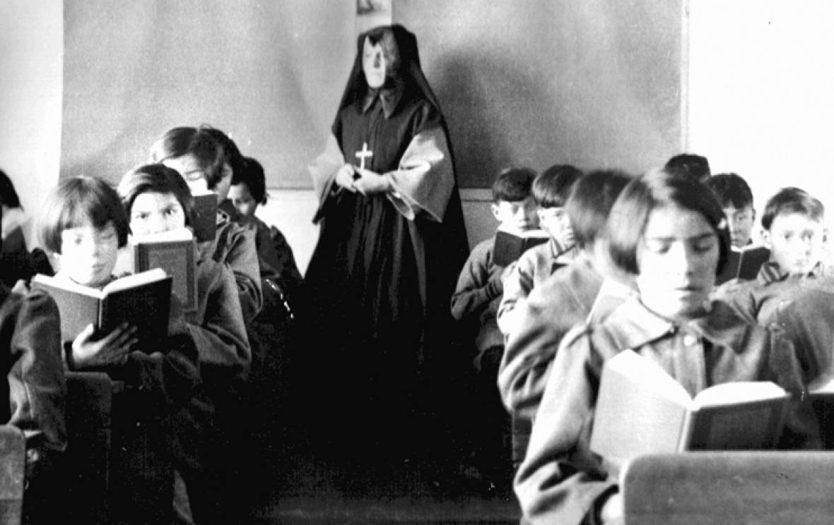 Children in a classroom at St. Anne's residential school in Fort Albany, Ont., in the 1940s. (Algoma University/Edmund Metatabwin Collection)
