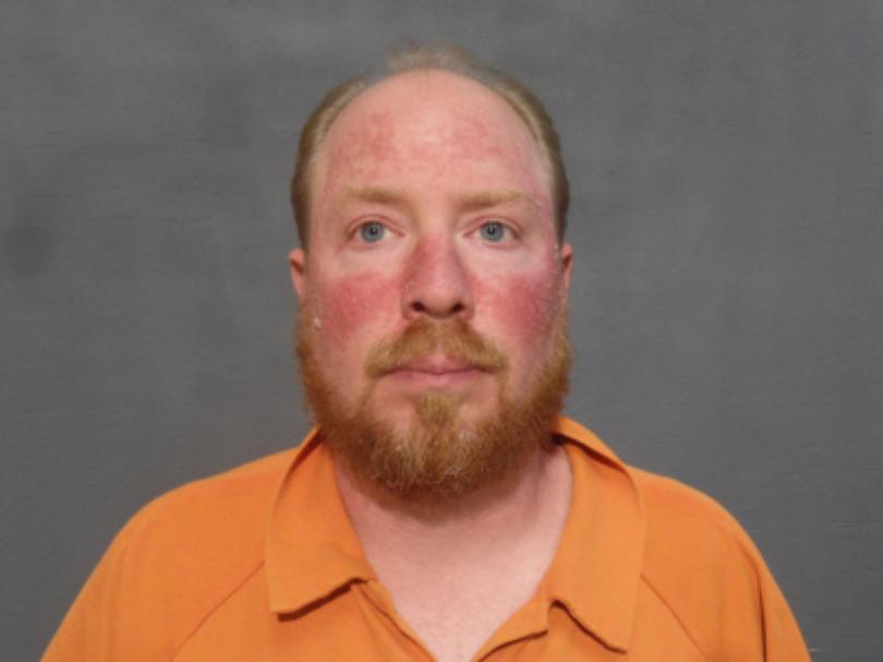 Booking photo from Houston County Jail.