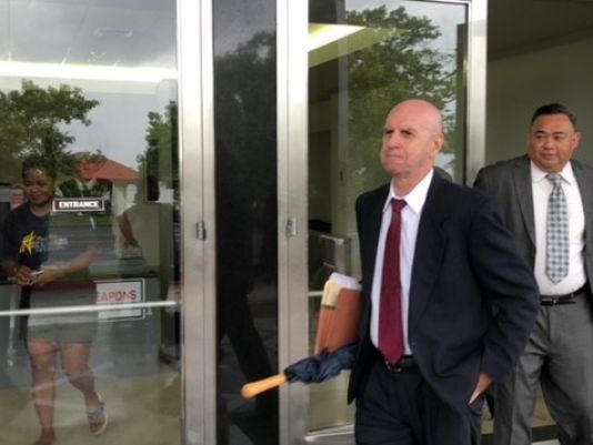 Attorney Michael Berman, left, counsel for nearly three dozen plaintiffs in clergy sex abuse cases, and Attorney Vincent Camacho, right, representing the Capuchin Franciscans, exit the U.S. District Court building Tuesday morning after a joint hearing on the status of 174 clergy sex abuse cases along with 10 abuse claims that don't involve lawsuits.