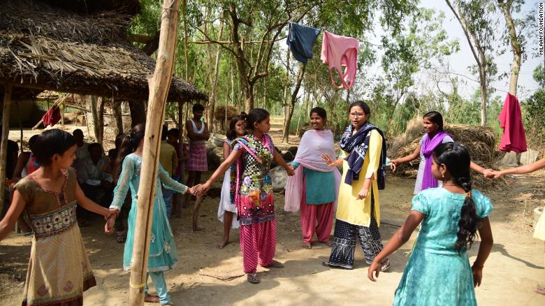 Rajni Devi (center, in light pink) helps coach girls in her small village, in Uttar Pradesh, on how to get an education and achieve dreams beyond marriage.