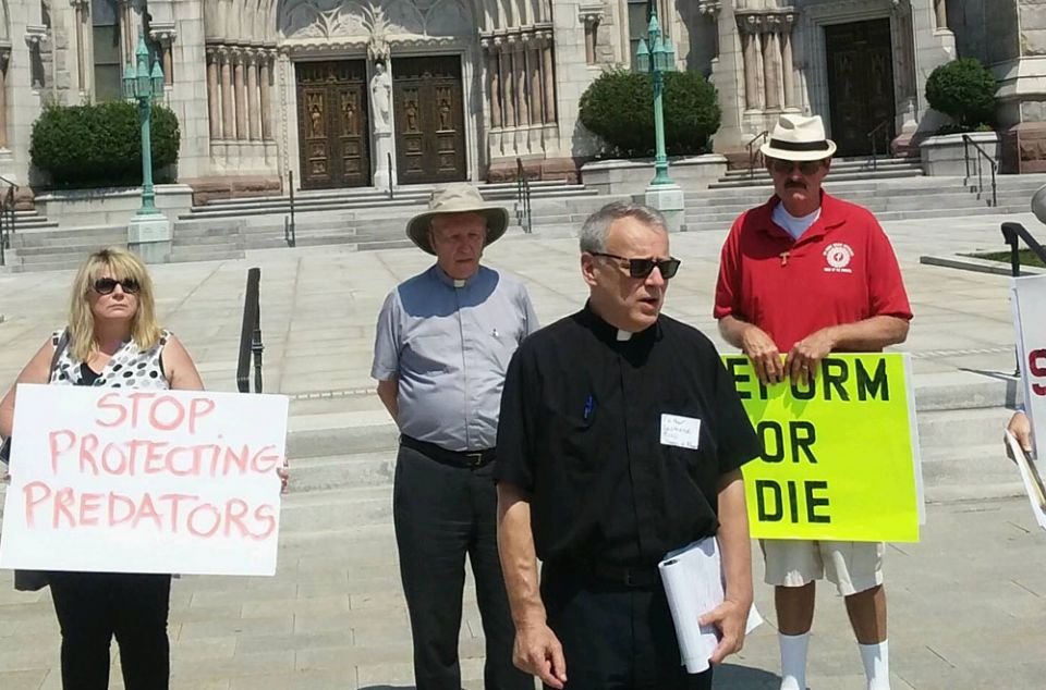 Fr. Desmond Rossi leads a prayer demonstration Aug. 29 in front of Sacred Heart Basilica Cathedral in Newark, New Jersey (NCR/Peter Feuerherd)