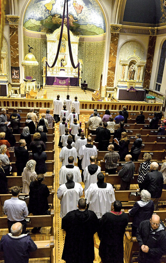 Clergy members process at the beginning of the Solemn High Mass held as penance on Monday at Queen of Peace Catholic Church in Patton. More than 100 people attended the service of atonement for the sins of clergy sexual abuse. Mirror photo by Gary M. Baranec