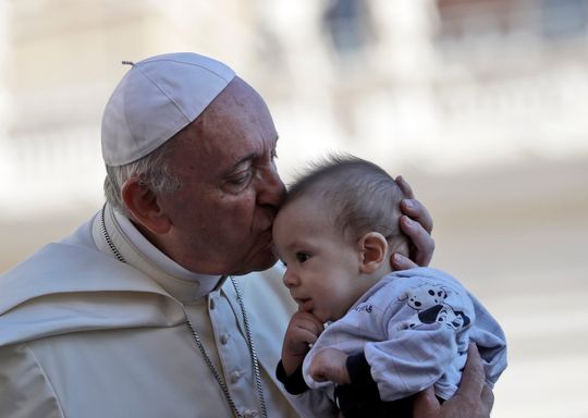 Pope Francis kisses a baby as he arrives in St. Peter's Square at the Vatican for his weekly general audience, Wednesday, Sept. 12, 2018. (Photo: Alessandra Tarantino / AP)