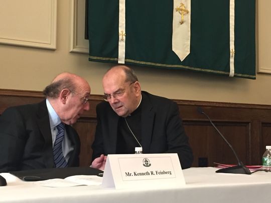 Bishop Robert Cunningham, right, speaks with Kenneth Feinberg, one of the lawyers directing a clergy sexual abuse settlement program, after a news conference announcing the program Wednesday. (Photo: Hannah Schwarz / Staff photo)