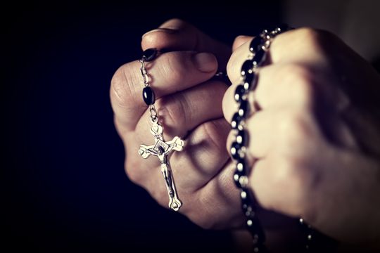 Closeup image of hands and rosary (Photo: tiero, Getty Images/iStockphoto)