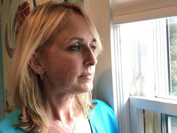 Kristen Pfautz Woolley was sexually abused as a child. Now a therapist, she is fighting to reform state child sex crime laws. She says child sex abuse has nothing to do with the Catholic Church. (Ivey DeJesus)
