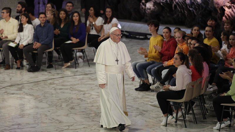Pope Francis leaves the Paul VI hall at the end of his meeting with youths attending the synod at the Vatican on Saturday. The three-week meeting will likely be dominated by what many analysts call Catholicism's worst crisis since reformation.