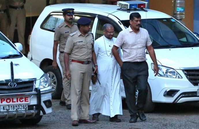 Bishop Franco Mulakkal of Jalandhar, India, is led away for questioning by police Sept. 19 on the outskirts of Cochin. (Credit: Sivaram V, /Reuters via CNS.)