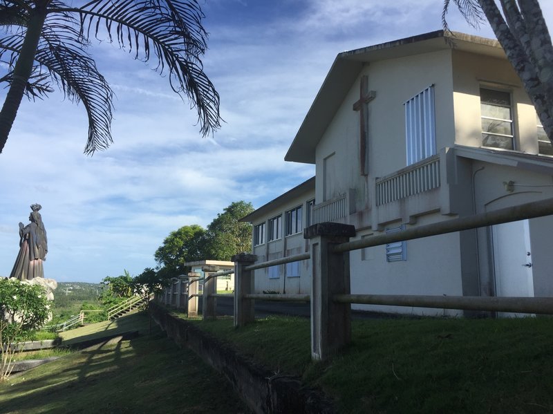 The office and residence of the Archbishop of Agana in Guam, seen Wednesday. The house was listed as one of the non-essential properties owned by the Catholic Church in the U.S. territory, which announced that it will file for bankruptcy.
