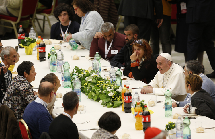 Pope Francis eats lunch with poor people as he marks World Day of the Poor at the Vatican Nov. 18. Some 1,500 people joined the pope for lunch in Paul VI hall. (CNS photo/Paul Haring)