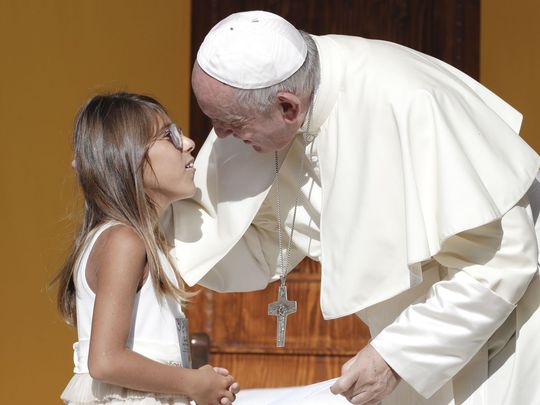 Pope Francis greets a young girl during his visit to Piazza Armerina, Italy, on Sept. 15, 2018. Pope Francis was paying tribute in Sicily to a priest who worked to keep youths away from the Mafia. (Photo: ANDREW MEDICHINI/AP)