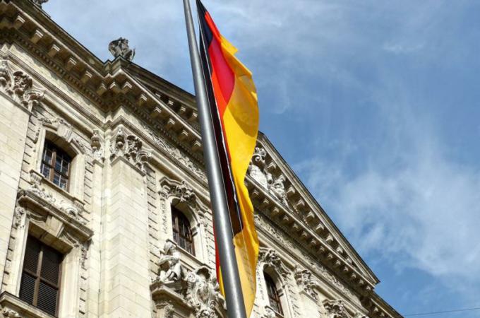 The German flag is seen outside the Ministry of Justice in Munich. German police and prosecutors are launching investigations into clergy sexual abuse following the Sept 12. leak of a report containing evidence of 3,700 alleged child sex abuse cases in the Catholic Church over a 68-year-period. (CNS photo/Zita Ballinger Fletcher)