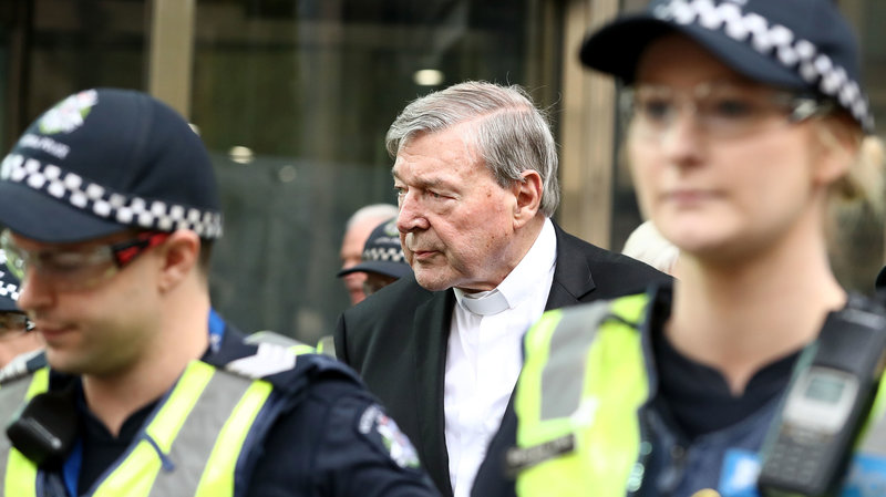 Cardinal George Pell, shown leaving court in Melbourne in May, was reportedly found guilty of sexual abuse, but Australian media are barred from reporting the news.