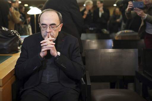 Cardinal Philippe Barbarin waits for the start of his trial at the Lyon courthouse, central France, Monday Jan. 7, 2019. Cardinal Barbarin and five others are going on trial in France accused of covering up for a pedophile priest who abused Boy Scouts. (AP Photo/Laurent Cipriani)