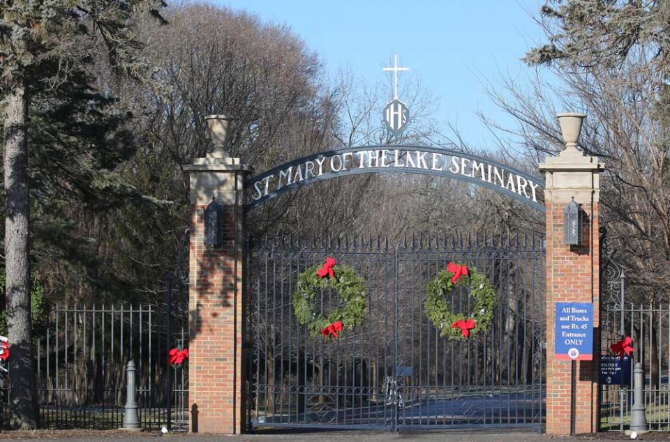 The normally open gate at the entrance to Mundelein Seminary is seen locked Jan. 3 at the University of St. Mary of the Lake in Illinois, near Chicago. (CNS/Bob Roller)