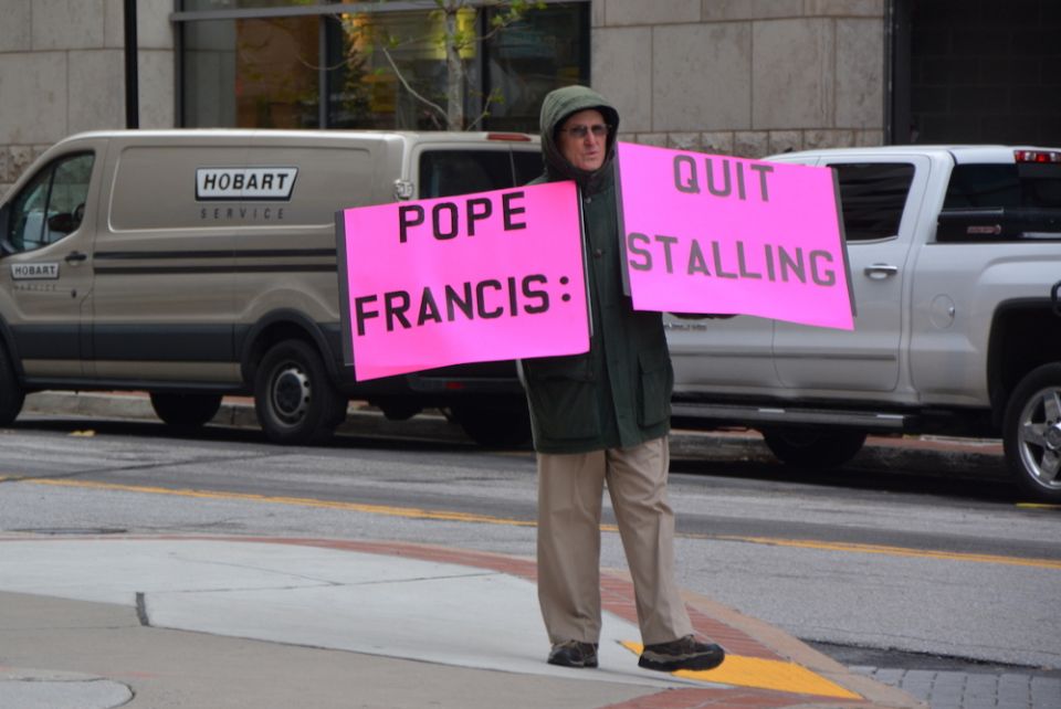 A lone protester stands outside the U.S. Conference of Catholic Bishops meeting in Baltimore on Nov. 13, 2018. (RNS photo/Jack Jenkins)