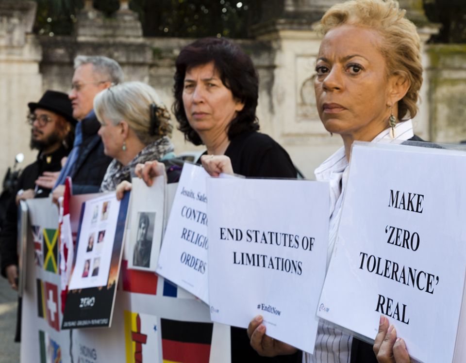 Denise Buchanan, right, a psychoneurologist and founding member of the Ending Clergy Abuse organization, and member Leona Huggins, second from right, participate in a protest outside the St. Anselm on the Aventine Benedictine complex in Rome on the second day of a summit called by Pope Francis at the Vatican on sex abuse in the Catholic Church on Feb. 22, 2019. (AP/Domenico Stinellis)