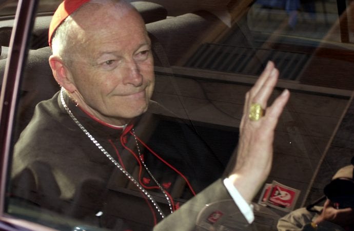 In this April 23, 2002 file photo former Cardinal Theodore McCarrick of the Archdiocese of Washington, waves as he arrives at the Vatican in a limousine. On Saturday, Feb. 16, 2019 the Vatican announced Pope Francis defrocked McCarrick after Vatican officials found him guilty of soliciting for sex while hearing Confession. (Credit: AP Photo/Andrew Medichini, file.)