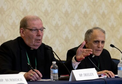 Robert Deeley, left, bishop of the Diocese of Portland, Maine, accompanied by Cardinal Daniel DiNardo, president of the U.S. Conference of Catholic Bishops, speaks during a news conference June 11, 2019, at the USCCB’s spring meetings in Baltimore. (AP Photo/Jose Luis Magana)