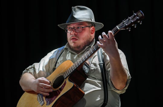 Chris Burton, who plays Catfish Blues, noodles on his guitar during a rehearsal for "Catholic Boy Blues" on June 12, 2019. (Photo: Michelle Pemberton/IndyStar)