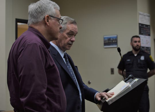 To the far left, former Westland priest Patrick Casey recently appeared in 18th District Court with his attorney because of a felony criminal sexual conduct charge. (Photo: Photo: Susan Vela | hometownlife.com)