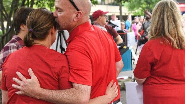 A woman is comforted after speaking at a rally this month outside a Southern Baptist Convention meeting in Birmingham, Ala., about being sexually abused by a minister. (Julie Bennett / AP)