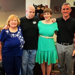 Anne Miller, with her husband, mother and brother who is refusing to smile.