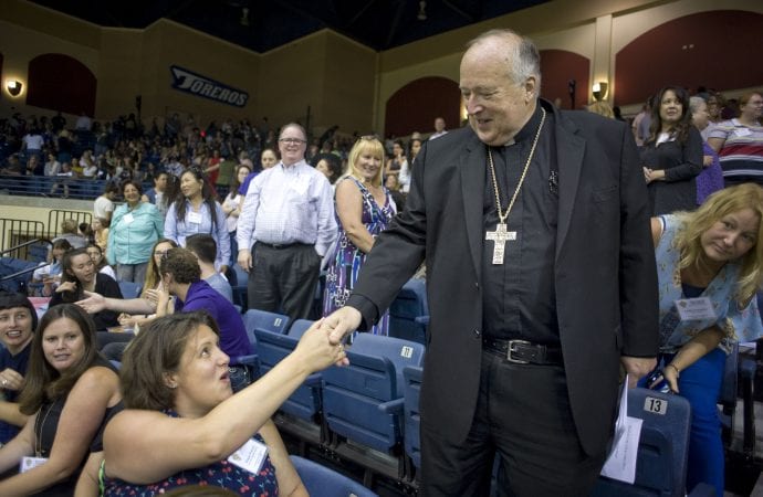 San Diego Bishop Robert W. McElroy greets an attendee during an Aug. 13, 2019 meeting with all of the more than 2,500 San Diego diocesan employees in response to Pope Francis's call to confront sexual abuse of minors and other vulnerable people. (Credit: CNS photo/David Maung.)