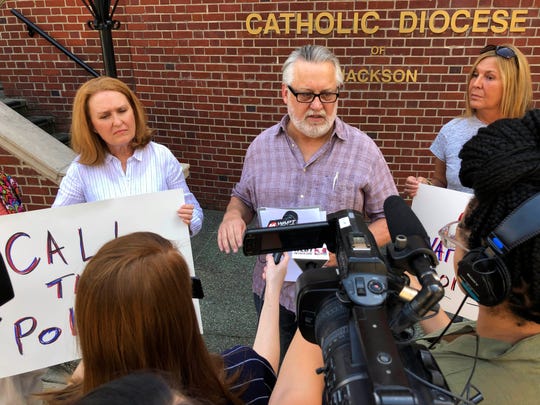 In this Aug 29, 2019 file photo, Mark Belenchia, center, says that he wants federal authorities to investigate the Catholic Diocese of Jackson, Miss., over the way the diocese settled abuse claims for three men in the Mississippi Delta. Belenchia is the volunteer coordinator in Mississippi for SNAP, Survivors Network for those Abused by Priests. (Photo: Emily Wagster Pettus/AP)