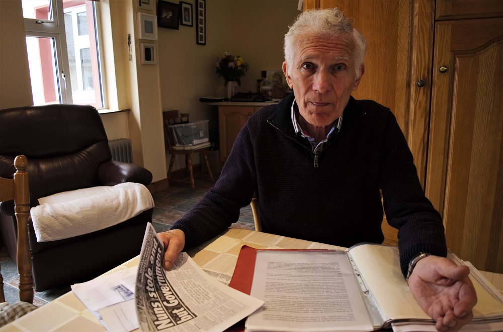Peter Mulryan sits at a kitchen table in his home in Ballinasloe, Ireland, and talks about his life of servitude as a child of an unmarried mother in an Ireland dominated by a repressive Catholic church. (Photo by CAIN BURDEAU/Courthouse News Service)